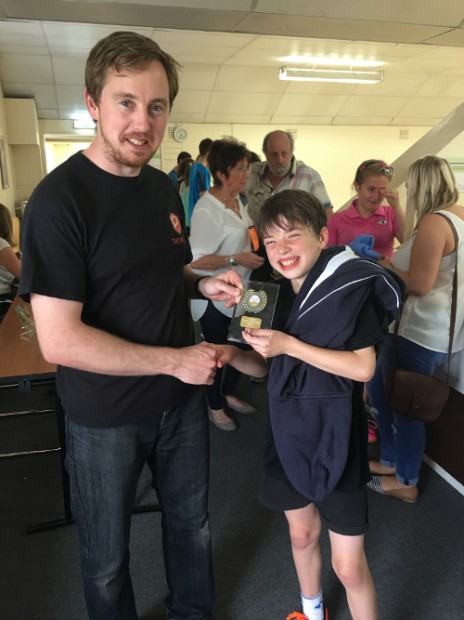 Oliver Coulcher-Porter receiving his winner prize